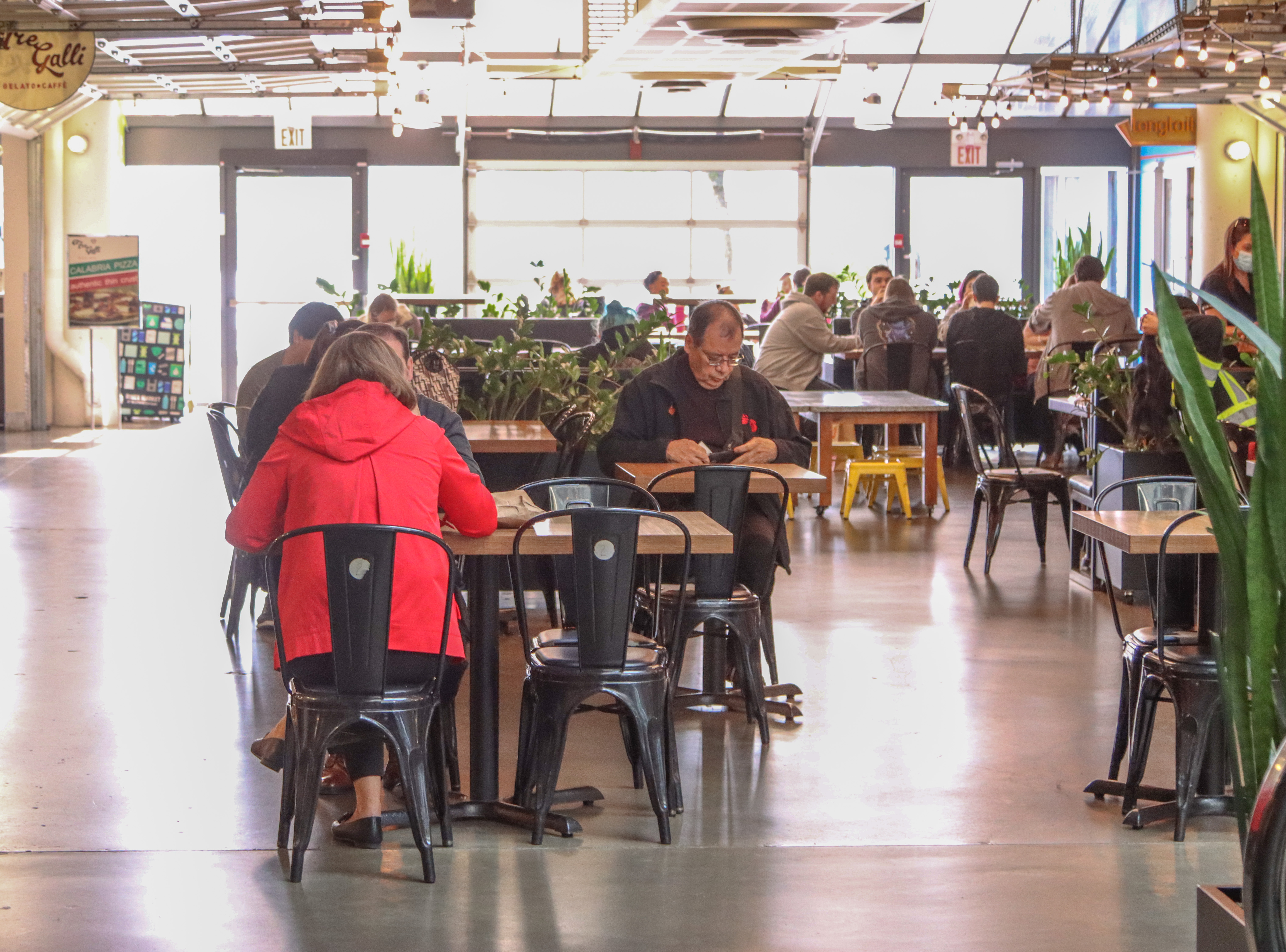 Image of customers sitting in a food court area